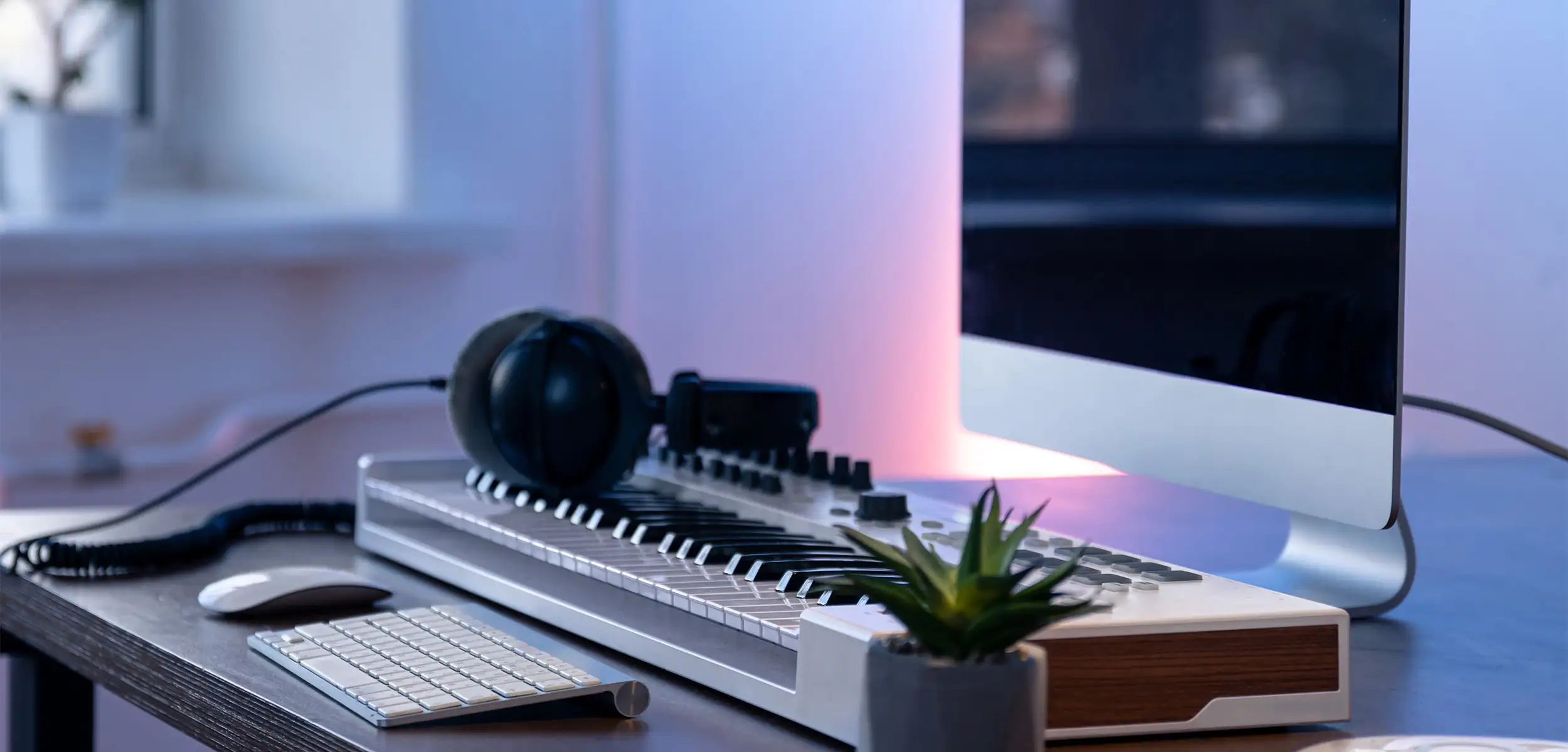 a keyboard with a keyboard and headphones on it