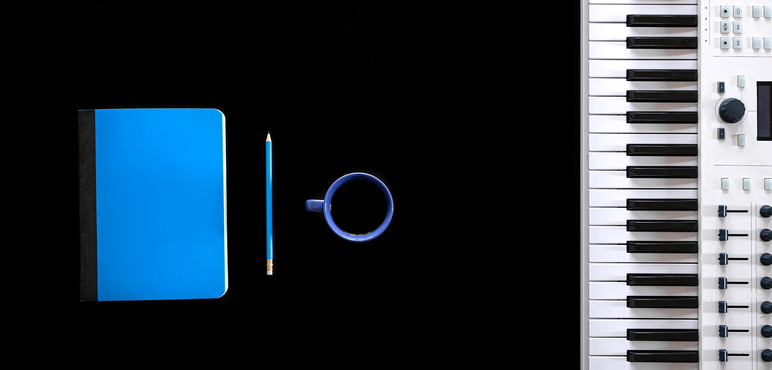a blue laptop and a cup of coffee