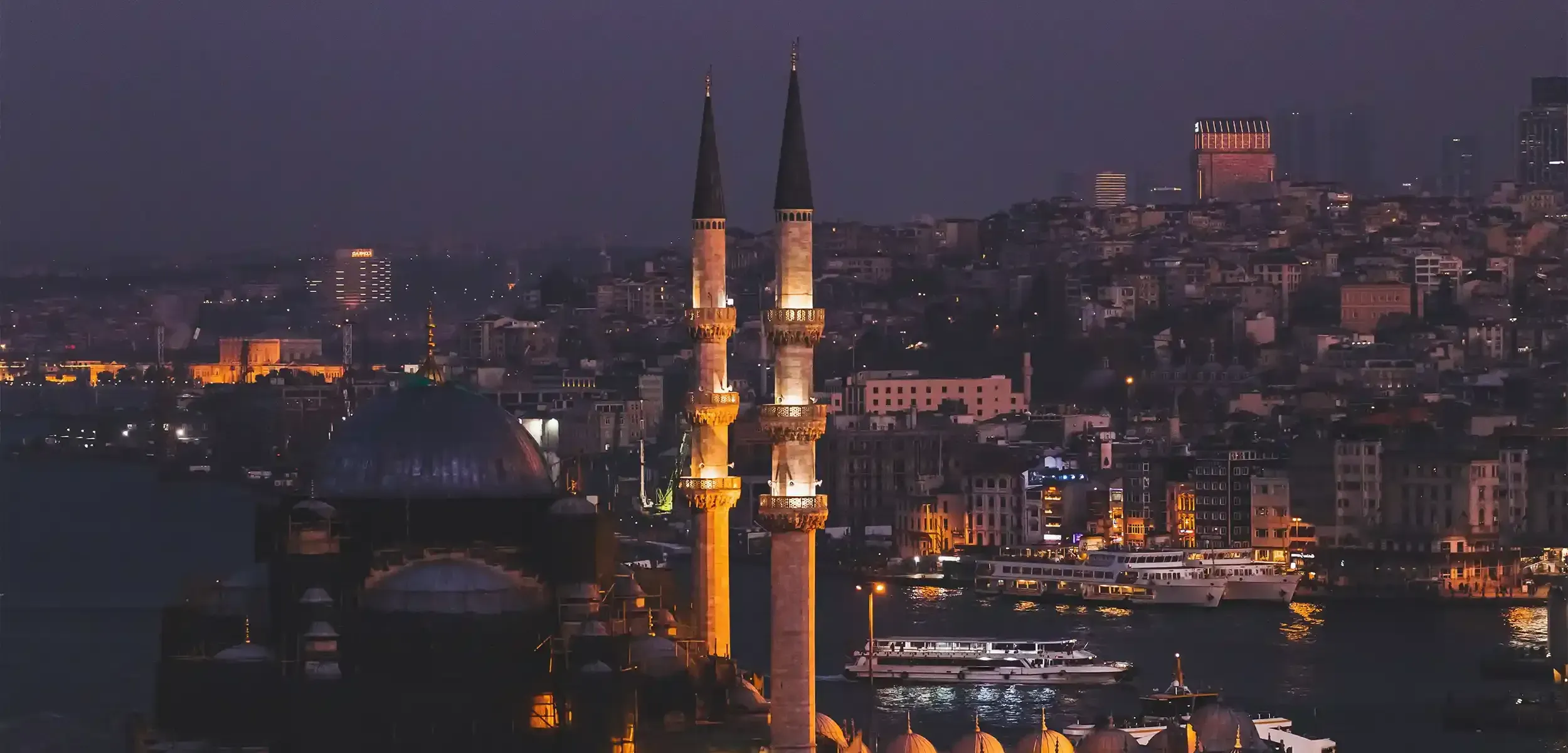 a tall towers with a city in the background