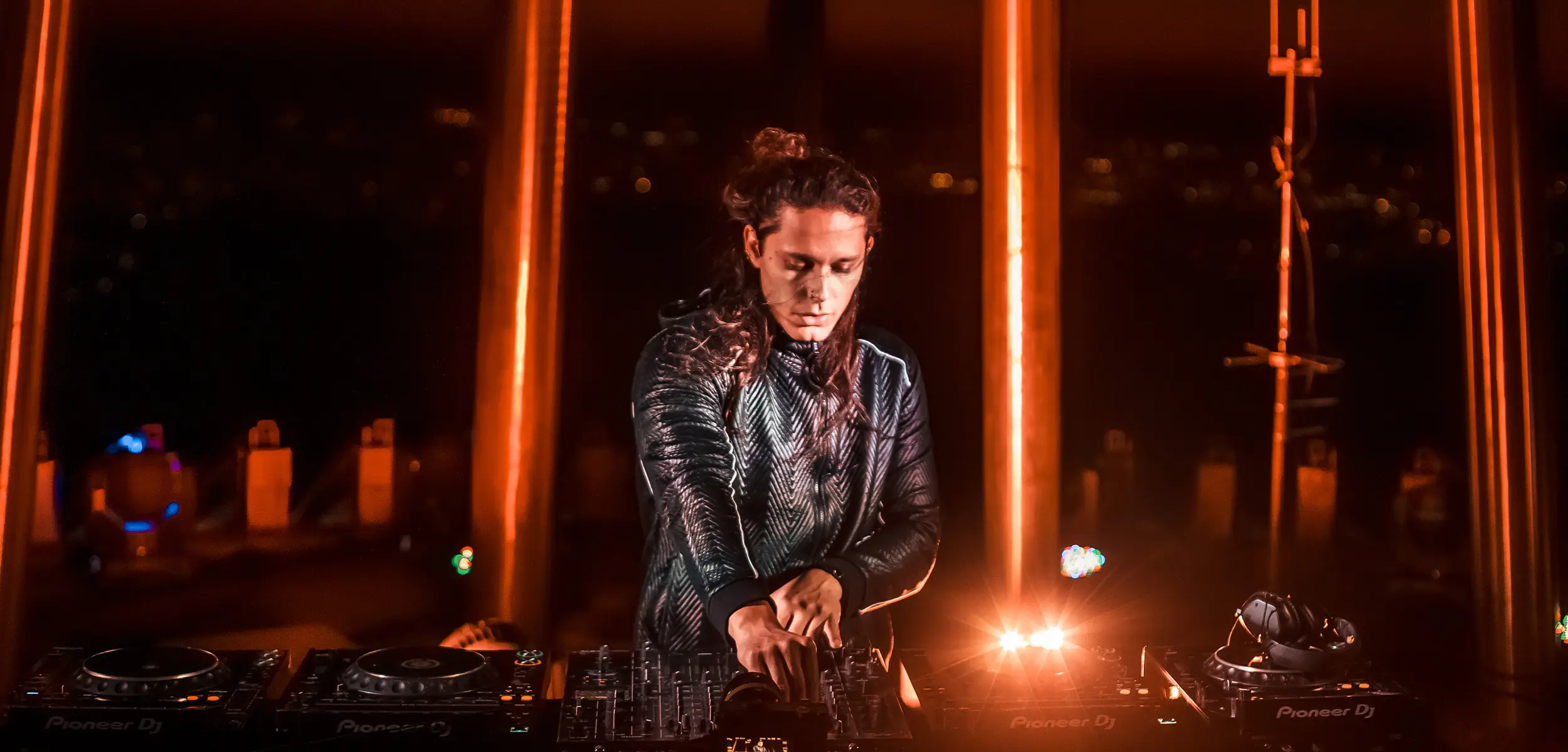 a man playing music on a mixer
